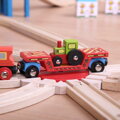 Hračka Bigjigs Rail Drevené vláčiky - Vagón s traktorom, 11915