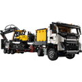Nákladné auto Volvo FMX a elektrický bager EC230